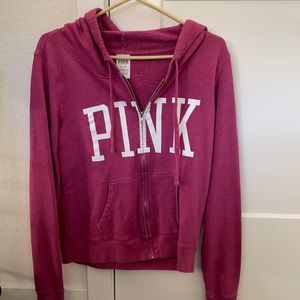 Worn but taken care of size medium PINK zip up hoodie.